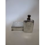 A silver hip flask, London 1892, together with a silver cigarette box, London 1936, gross 19.3oz (2)