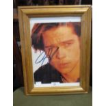 An autographed photo of Brad Pitt