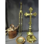 A brass cross, three copper watering cans, three trench art ashtrays etc.
