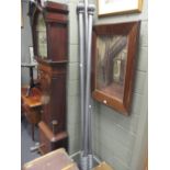A pair of silver-grey curtain poles, brackets and matching tie-backs all with rope-twist design,