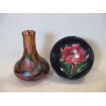 A small Moorcroft pottery bowl and a Loetz style glass bottle vase, 12cm high