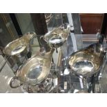 A pair of silver sauce boats by Goldsmiths & Silversmiths and another pair by Viners (4)