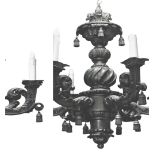 A pair of early 20th century carved oak six-branch chandeliers, heavily carved with foliate motifs