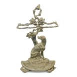A Coalbrookdale style cast iron stick stand, of rustic branch design and seated hound and a