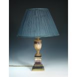 A Blue John table lamp, the lamp socket supported on the white flared neck and wide shoulders