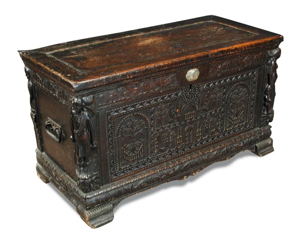 An early 17th century Continental carved wood cassonne, with plain panel top, carved panel front