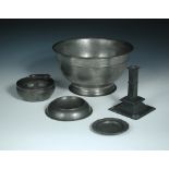 A small collection of mostly late 18th and early 19th century pewter wares, comprising a porringer