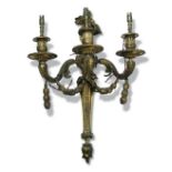 A pair of 19th century ormolu wall lights, each with three decorated branches and floral finials,