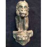 A lead 'devil' grotesque mount, the half length winged figure resting its chin on its hands 28cm (