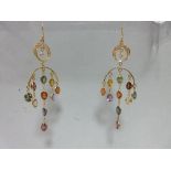 A pair of 18ct gold and rainbow gemset ear pendants, each wire hook suspending a closed crescent set