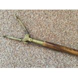 A 19th century ash and brass mounted library 'long-arm' book grab, with brass grab and iron