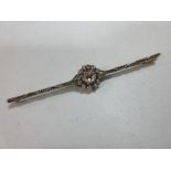 A rose cut diamond bar brooch, the central cluster with a 4.5mm diameter rose diamond in a border of