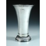 An Edwardian silver vase, by Lambert & Co, London 1910, raised from a circular ribbed foot below a