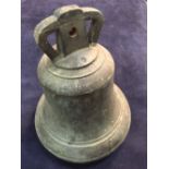 A 19th century bronze bell with iron clapper, 27.5cm (11in) diameter rather age worn