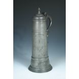A pewter flagon inscribed 'RB. IP. Wardens 1753', the late 17th century style vessel with spire