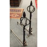 A large pair of 19th century wrought iron andirons, with five piece twist terminals 95 x 67cm (37