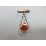 An antique French 18ct gold lady's fob watch with brooch suspender, the circular red guilloche