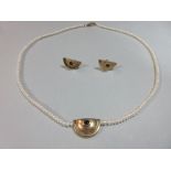A seed pearl and sapphire set necklace with earrings en suite, the uniform 3mm bouton seed pearls