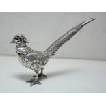 A silver pepper caster, maker ?S, import marked for London 1924, modelled as a pheasant, the drill