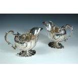 A substantial pair of Victorian silver sauceboats, by William Hutton & Sons, London 1896, each of