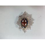 An 18ct white gold, diamond and enamel Regimental brooch for an officer of the Coldstream Guards,