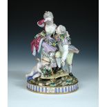 A 19th century Meissen group, the man looks up at his lady as she wipes a tear from her eye, one end
