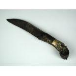 A South East Asian knife, 18th or 19th century, the shaped carved bone handle with silver mount,