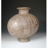 A Qin or Western Han dynasty cocoon vase, 33cm (13 in) high This has chips from the rim and foot