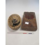 An 'Iron Cross' medal, a pudding stone bowl, African musical instrument and a coronation pencil