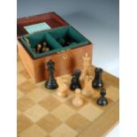 A modern Jaques Staunton pattern 4" chess set and board, contained with a mahogany baize lined box