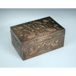 A Newlyn copper box, the rectangular box with hinged cover, embossed seahorses and shells, stamped