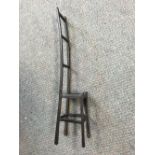 A small bronze model of a high back chair, unmarked 38½cm (15in)