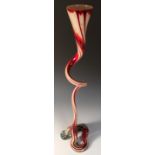 A large art glass vase, the coiled form with trumpet bowl in mottled red and white cased glass