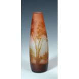 A Gallé cameo glass vase, the tapering cylindrical body decorated with a lakeside landscape,