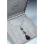 A modern Lalique glass pendant necklace, the silvered metal chain with three blue and amethyst