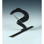 A silvered and patinated bronze model of a stylised skier after the original by Hagenauer,