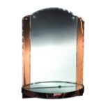 An Art Deco style mirrored wall shelf, the shaped backplate flanked by rose-coloured panels above
