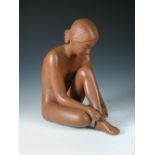 A Goldscheider terracotta figure of a seated nude, model no. 8714, together with a terracotta