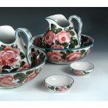 A collection of Wemyss cabbage rose pattern wares, comprising two jug and bowl sets and two small