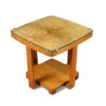 An Art Deco walnut occasional or lamp table, the quarter-veneered top raised on four supports with a