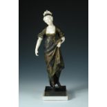 Gustavo Obiols Delgado (Spanish, 1858-1910), a bronze and ivory figure of a lady with her parasol,