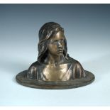 After Raoul Larche, (French 1860-1912), a bronze bust of Joan of Arc, mounted to a wooden plinth