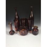 A collection of Mdina tortoiseshell glass, comprising two slender bottle forms, a near pair of