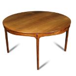 A 1960's Danish rosewood table, probably by J. L. Moller, the circular top raised on four tapering