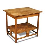 An Art Nouveau oak side table, the rectangular top above a secondary tier and stretchers united by