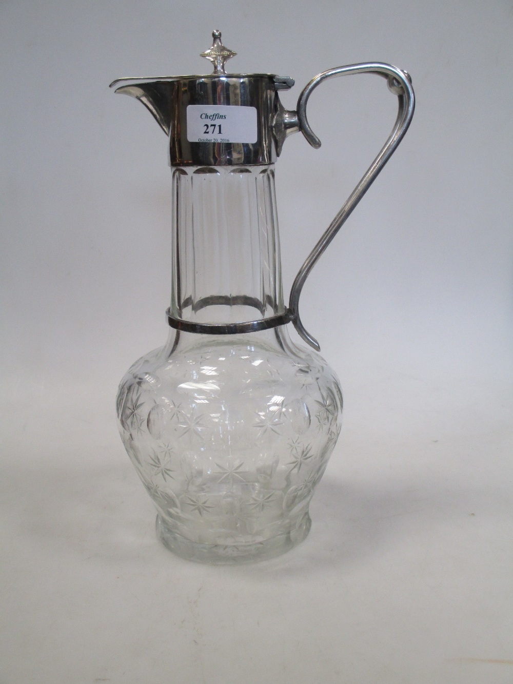 A cut glass and silver plated claret jug