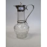 A cut glass and silver plated claret jug