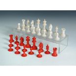 A red and white bone Staunton chess set, the pieces of typical shape, the kings 6.5cm (2.5 in)