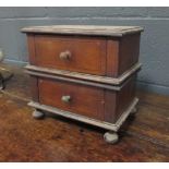 A miniature chest of drawers