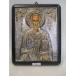 A modern Greek Orthodox white metal and gold plated reproduction of a Byzantine icon with painted